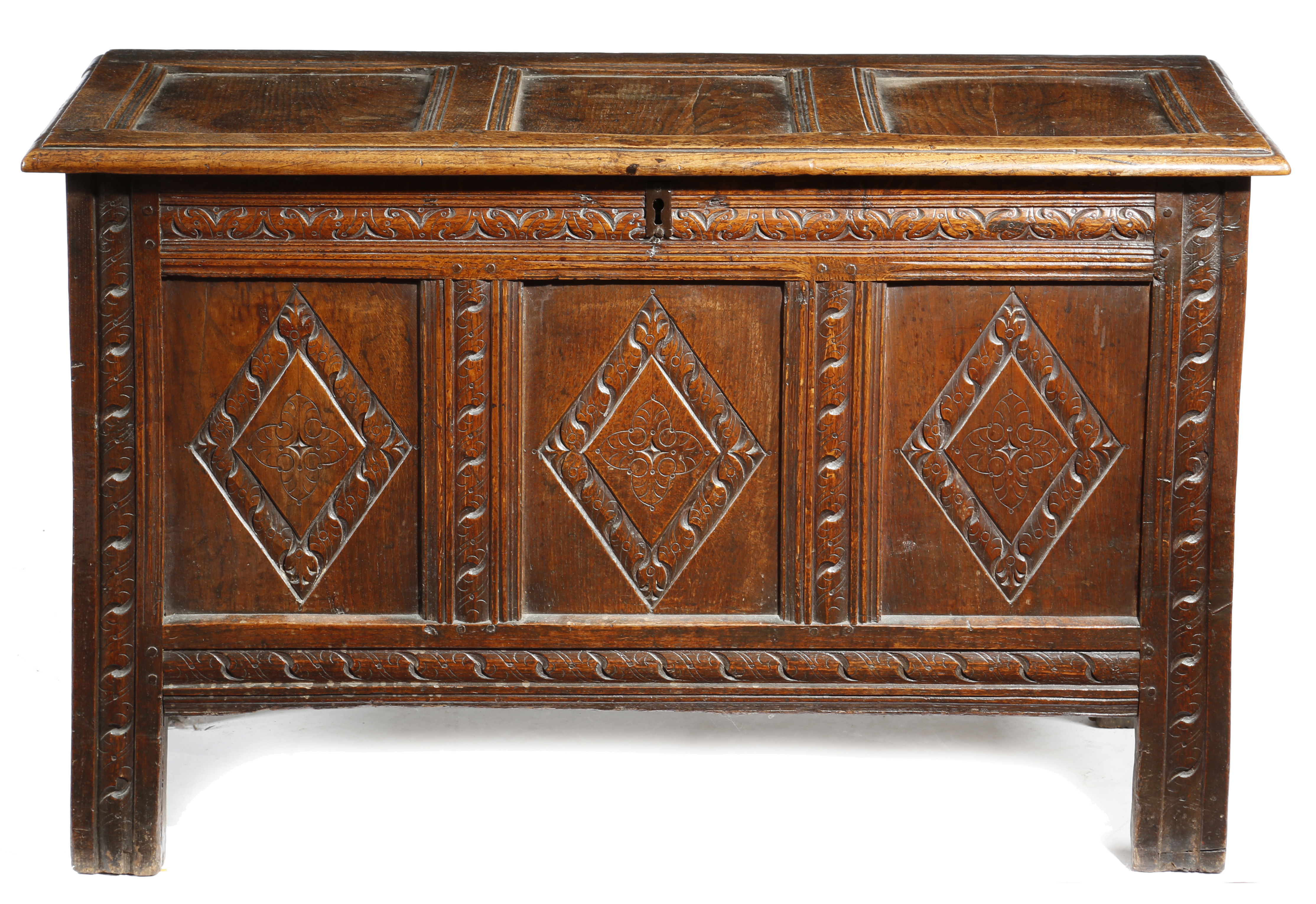 A CHARLES II OAK TRIPLE PANELLED COFFER LATE 17TH CENTURY the hinged top revealing an interior