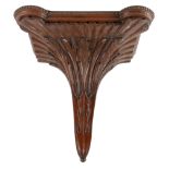 A CARVED MAHOGANY WALL BRACKET 19TH CENTURY the breakfront top with a beaded moulding above fan,