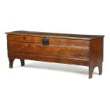 AN ELM BOARDED SWORD CHEST LATE 17TH / EARLY 18TH CENTURY with a vacant interior, the front with