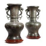 A PAIR OF CHINESE BRONZE ARCHAISTIC VASES 19TH CENTURY each decorated with lappet panels and with