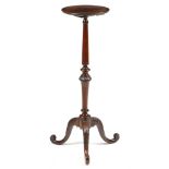 A MAHOGANY CANDLESTAND GEORGE II AND LATER the circular dished fixed top on a turned and leaf carved