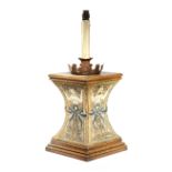 AN OAK AND TAPESTRY MOUNTED TABLE LAMP LATE 19TH / EARLY 20TH CENTURY with a foliate tin sconce,