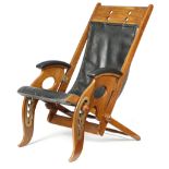 A WALNUT AND BRASS MOUNTED FOLDING ARMCHAIR IN CAMPAIGN STYLE EARLY 20TH CENTURY with an