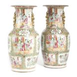 A PAIR OF CHINESE CANTON FAMILLE ROSE PORCELAIN VASES 19TH CENTURY painted with coloured enamels