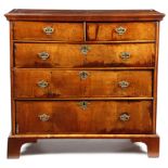 A WALNUT CHEST EARLY 18TH CENTURY AND LATER the quarter veneered top with cross and feather banding,