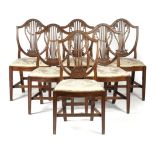 A SET OF SIX GEORGE III MAHOGANY DINING CHAIRS HEPPLEWHITE PERIOD, C.1790-1800 each with a shield