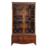 A MATCHED PAIR OF MAHOGANY BOOKCASES IN REGENCY STYLE 19TH CENTURY AND LATER each with a pair of