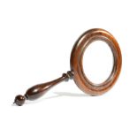 λ A SMALL EARLY VICTORIAN ROSEWOOD MAGNIFYING GLASS C.1840 with a moulded frame and a turned