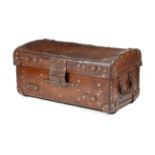 A LARGE LEATHER TRUNK EARLY 20TH CENTURY with brass mounts and a linen lined interior 48cm high,