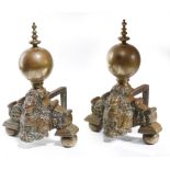 A PAIR OF DUTCH BRASS ANDIRONS 18TH CENTURY each with a turned ball finial, above a shaped base