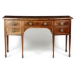 A GEORGE III MAHOGANY BOWFRONT SIDEBOARD C.1790-1800 inlaid with stringing, the crossbanded top