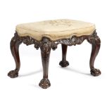 A MAHOGANY STOOL IN GEORGE II STYLE BY HOWARD & SONS, LATE 19TH CENTURY the needlework stuffed-