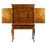 A WILLIAM AND MARY WALNUT CABINET ON STAND LATE 17TH / EARLY 18TH CENTURY the moulded cornice
