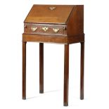 A GEORGE II MAHOGANY BUREAU ON STAND MID-18TH CENTURY the hinged fall revealing four mahogany