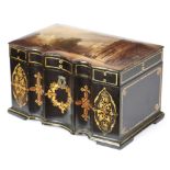 A VICTORIAN PAPIER-MACHE TEA CADDY C.1860 with a serpentine front decorated with gilt lines and