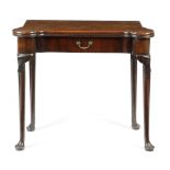A GEORGE II RED WALNUT TEA TABLE C.1740 the hinged top with protruding corners revealing four sunken