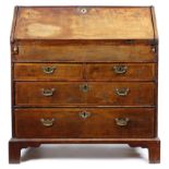 A GEORGE I WALNUT BUREAU EARLY 18TH CENTURY the hinged fall revealing an arrangement of drawers