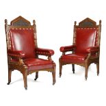 A PAIR OF LARGE 19TH CENTURY CARVED OAK ARMCHAIRS IN GOTHIC STYLE C.1870 each with a padded red