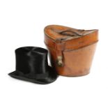 A BLACK SILK TOP HAT EARLY 20TH CENTURY the interior marked with a cartouche with a recumbent lion