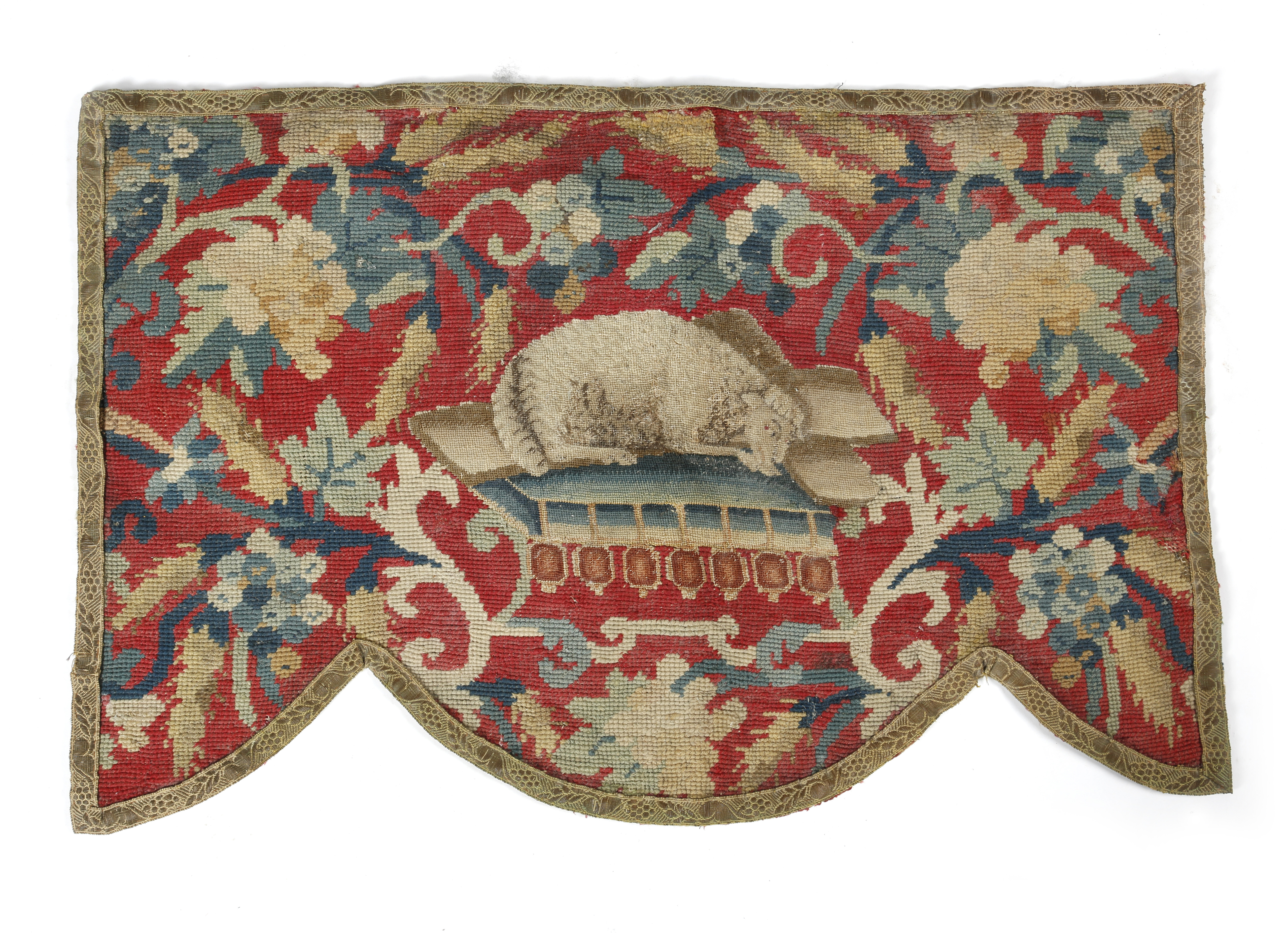 A GEORGE II NEEDLEWORK PANEL C.1740 worked in gros point with a recumbent sheep on a tasselled