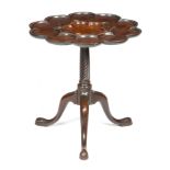 A GEORGE II MAHOGANY SUPPER TABLE IN THE MANNER OF FREDERICK HINTZ, C.1740 the dished ten-lobed