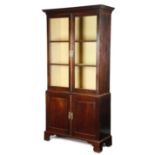 A GEORGE II MAHOGANY BOOKCASE CABINET MID-18TH CENTURY the moulded cornice above a pair of