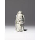 A CHINESE CHICKEN-BONE JADE CARVING OF ZHOU YANZI 18TH CENTURY The boy carved standing holding a