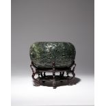 A LARGE CHINESE SPINACH-GREEN JADE 'DRAGON' BRUSH WASHER 19TH CENTURY The exterior carved in