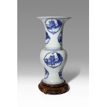 A CHINESE BLUE AND WHITE 'BAXIAN' YEN YEN VASE KANGXI 1662-1722 Painted to the exterior in
