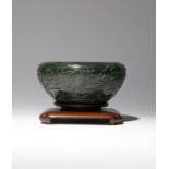 A LARGE CHINESE SPINACH-GREEN JADE 'DRAGON' BRUSH WASHER 19TH CENTURY The rounded sides carved in