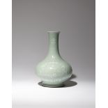 A CHINESE CELADON GLAZED SLIP-DECORATED BOTTLE VASE, BIQIPING SIX CHARACTER QIANLONG MARK AND OF THE