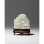 A SMALL CHINESE WHITE JADE 'MOUNTAIN' CARVING QIANLONG 1736-95 Formed as a rocky cliff face,