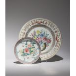 TWO CHINESE FAMILLE ROSE DISHES 18TH CENTURY The smaller dish decorated with a large spray of