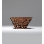 λ A CHINESE RHINOCEROS HORN 'LOTUS AND GRAIN' LIBATION CUP 18TH CENTURY The exterior carved in