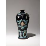 A CHINESE FAHUA VASE, MEIPING 16TH CENTURY Decorated in relief with two large floral sprays