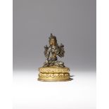 A SMALL TIBETAN SILVER FIGURE OF WHITE TARA 15TH/16TH CENTURY Depicted seated in dhyanasana