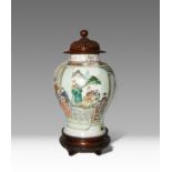 A CHINESE FAMILLE VERTE BALUSTER VASE KANGXI 1662-1722 Painted with scholar-officials and their