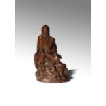 A CHINESE BAMBOO FIGURE OF SHOULAO 17TH/18TH CENTURY The God of Longevity carved seated on a rocky