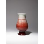 A CHINESE LANGYAO PEAR-SHAPED VASE 18TH/19TH CENTURY The body supported on a tall spread foot and