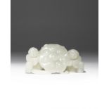 A CHINESE PALE CELADON JADE 'LOTUS AND BOYS' CARVING QING DYNASTY Formed as two kneeling children