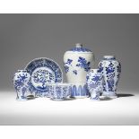 FOUR CHINESE BLUE AND WHITE VASES AND A TEA BOWL AND SAUCER 18TH AND 19TH CENTURY Comprising: a