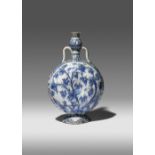 A RARE SAFAVID BLUE AND WHITE PILGRIM FLASK 17TH CENTURY The compressed body moulded to each