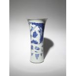 A CHINESE BLUE AND WHITE SLEEVE VASE TRANSITIONAL C.1640 Painted with an official bowing to the