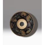 A CHINESE JIZHOU-TYPE BLACK GLAZED BOWL SONG DYNASTY The sides moulded with two continuous raised