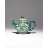 A CHINESE FAMILLE VERTE MOULDED 'PRUNUS' TEAPOT AND COVER KANGXI 1662-1722 Decorated with two