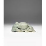 A CHINESE CELADON JADE BRUSH WASHER QING DYNASTY The beehive-shaped pot surrounded by a crouching