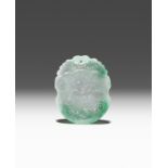 A CHINESE APPLE GREEN JADEITE PENDANT QING DYNASTY Carved in low relief with a boy holding a long