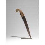 A MUGHAL DAGGER WITH A JADE HILT 19TH CENTURY The blade set in a jade hilt carved with a foliate