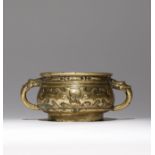 A CHINESE BRONZE INCENSE BURNER QING DYNASTY The bombé-shaped body cast in relief with archaistic