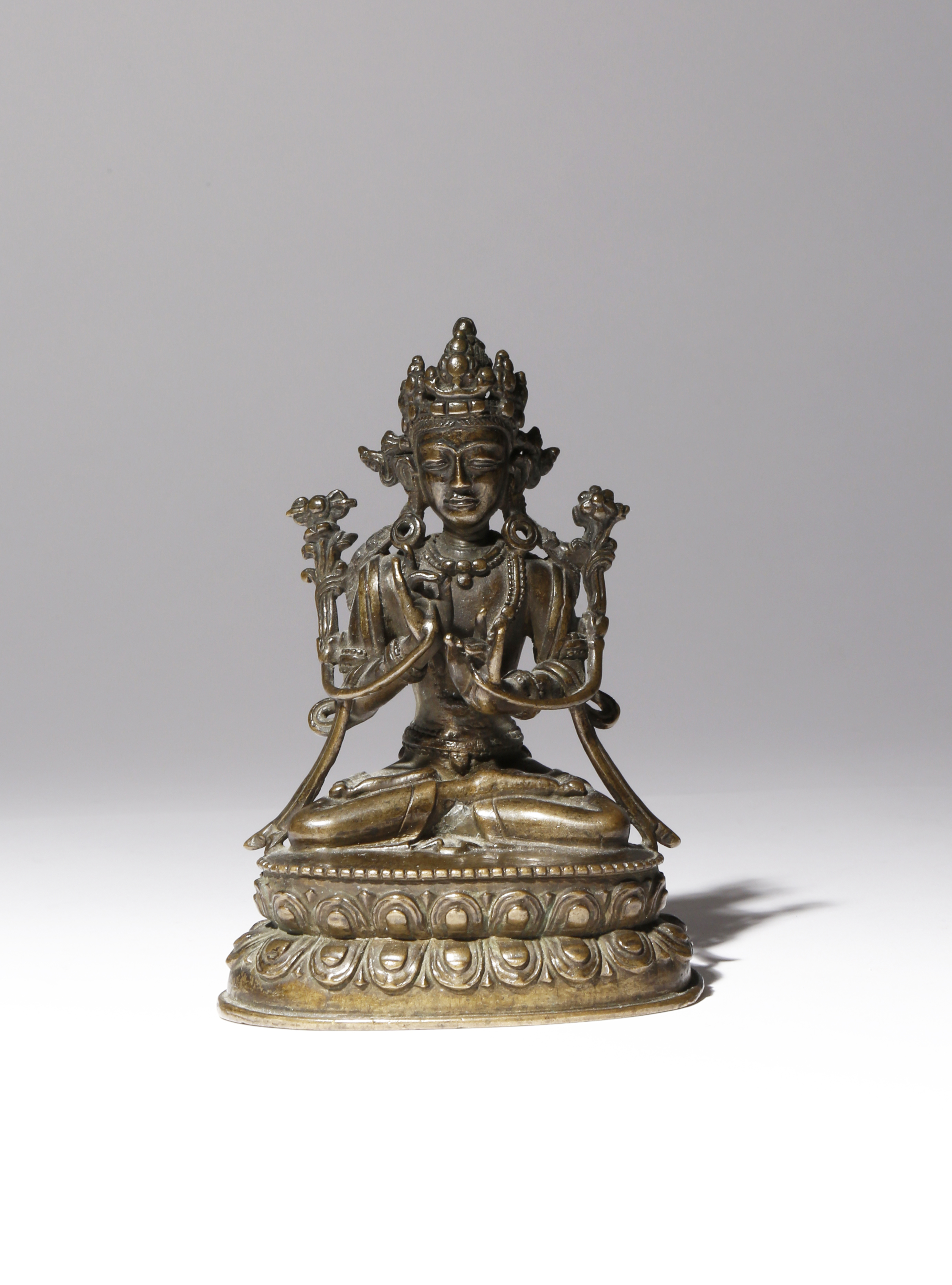 A TIBETAN BRONZE FIGURE OF VAJRAPANI 17TH/18TH CENTURY The bodhisattva cast seated in dhyanasana